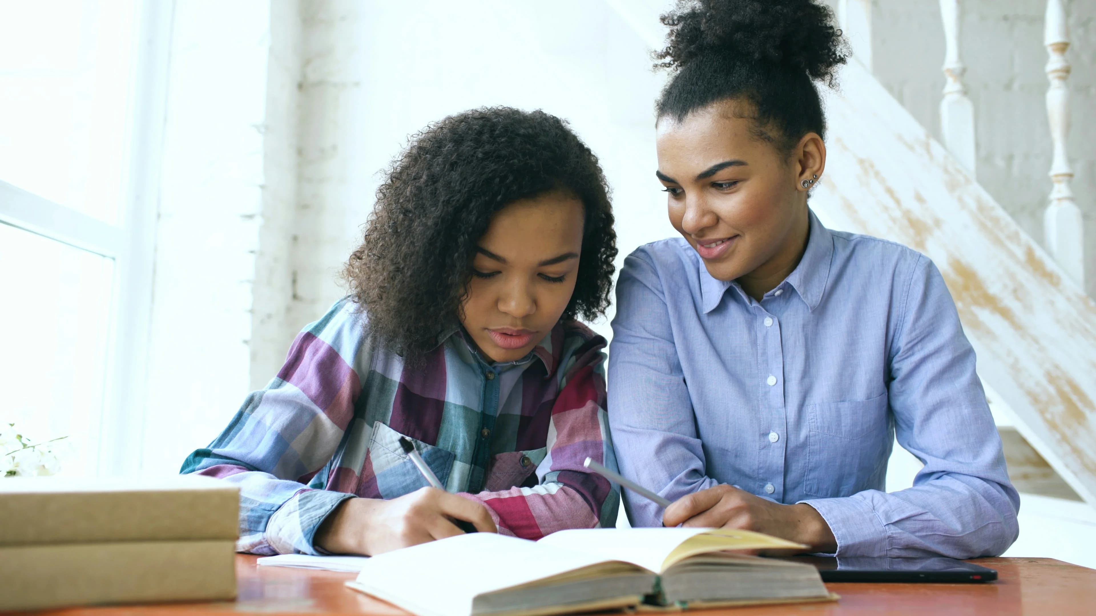 Mother and daughter studying together